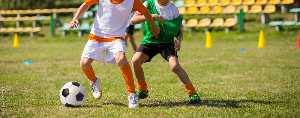 Soccer football game for children. Kids playing football soccer Soccer football game for children. Kids playing football soccer