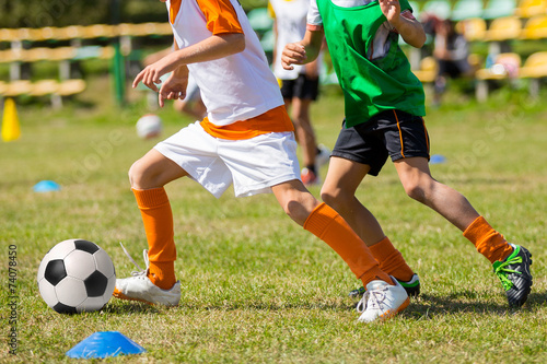 Fototapeta Naklejka Na Ścianę i Meble -  Football soccer match for children. kids playing soccer game