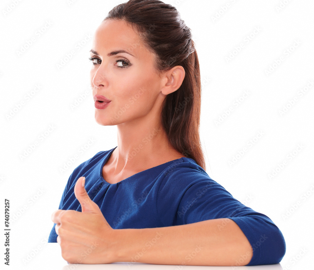 Cute girl with thumb up gesturing great job Cute girl with thumb up gesturing great job