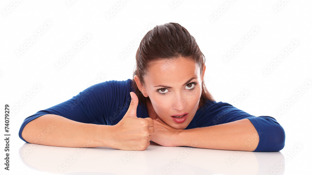 Young lady with thumb up gesturing great job Young lady with thumb up gesturing great job