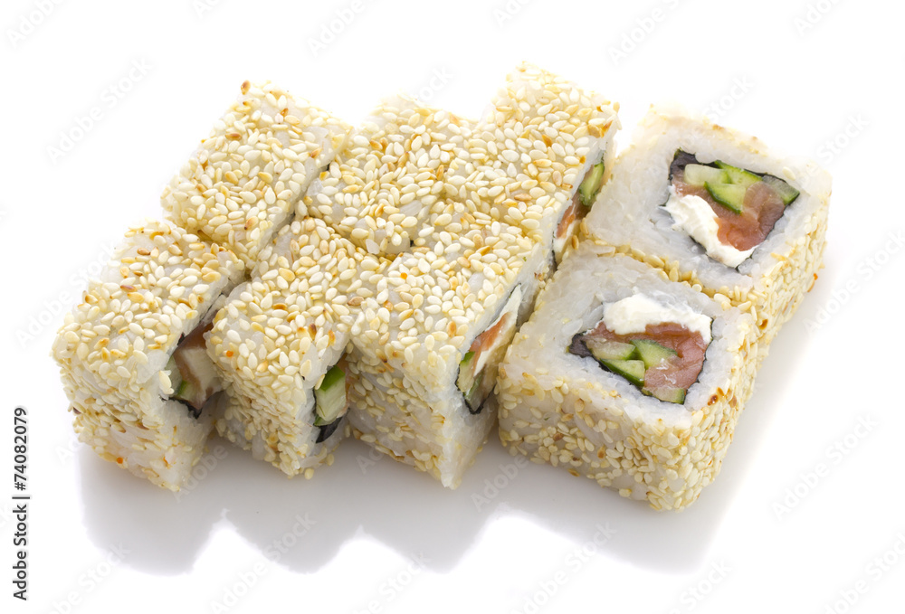 Sushi roll with salmon cheese and vegetables and sesame isolated