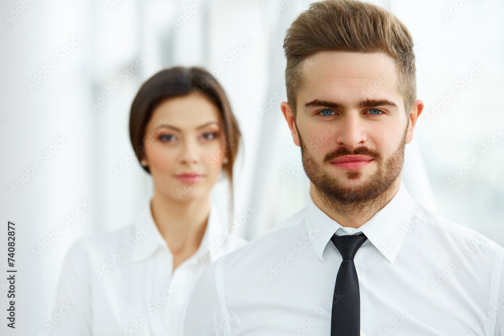 Business Team. Happy smiling people standing in office Business Team. Happy smiling people standing in office
