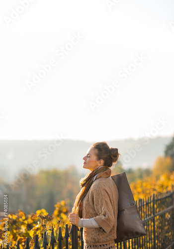 Portrait of relaxed young woman in autumn outdoors