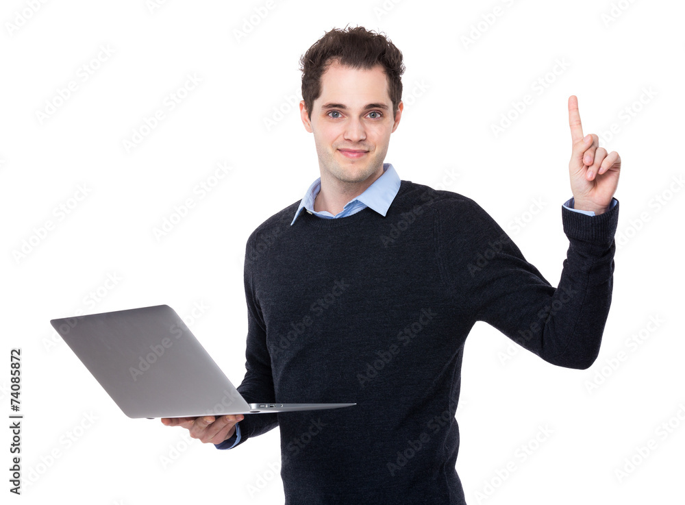 Businessman use of laptop and finger point up Businessman use of laptop and finger point up