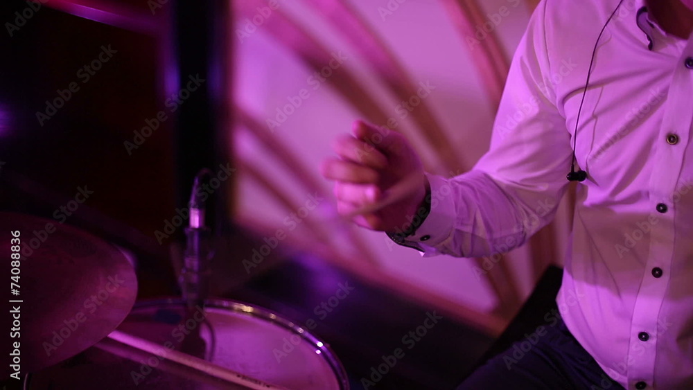 Musician turns the drummer drumstick in his hand Musician turns the drummer drumstick in his hand