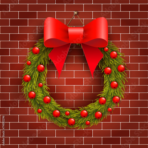Christmas wreath on the brick wall