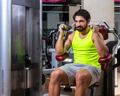 Slika na platnu Abdominal crunch machine workout man