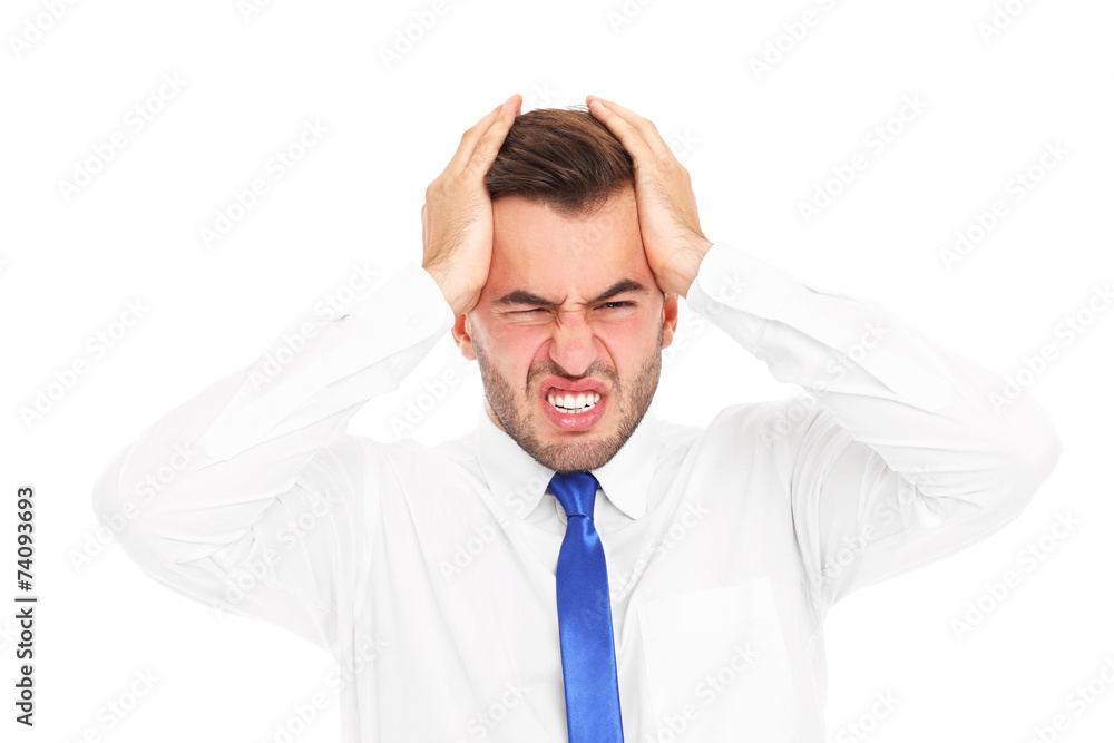 Overworked businessman suffering from headache Overworked businessman suffering from headache