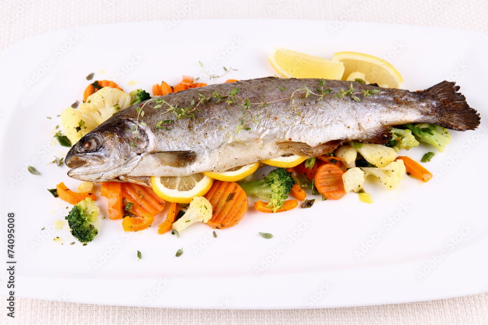 Grilled whole trout with vegetables and lemon Grilled whole trout with vegetables and lemon