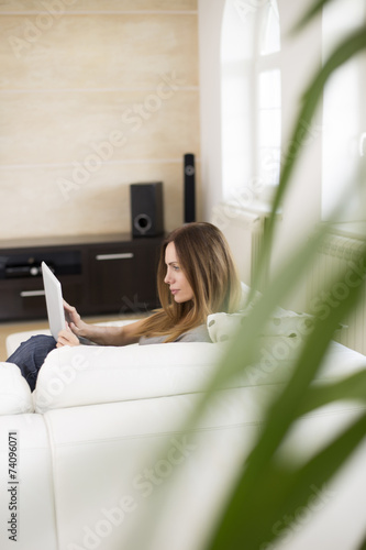 Young woman with tablet at ...