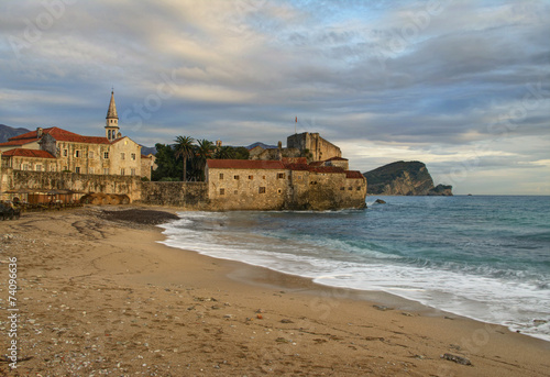medieval city and sea in sunset