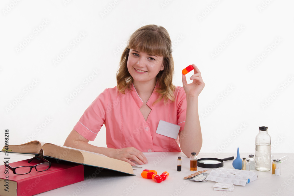doctor with a big pill in hand doctor with a big pill in hand