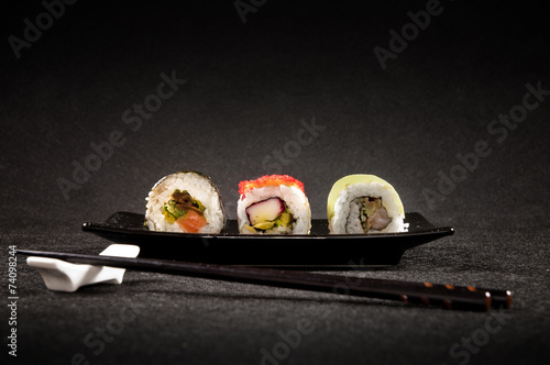 Luxurious sushi on black background - japanese cuisine