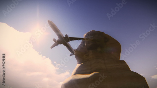 Airplane flying over the Great Sphinx of Giza
