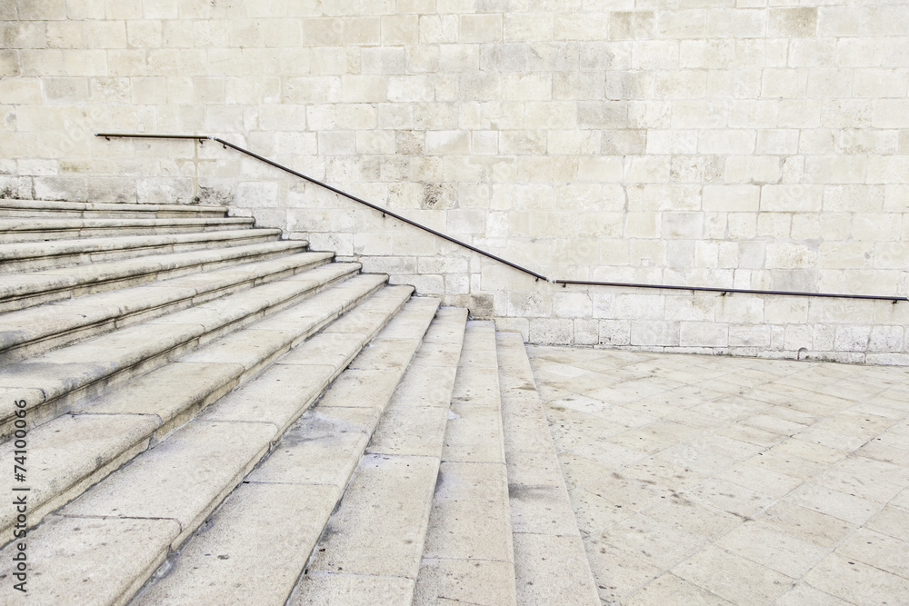 Ancient stone stairs with handrail Ancient stone stairs with handrail