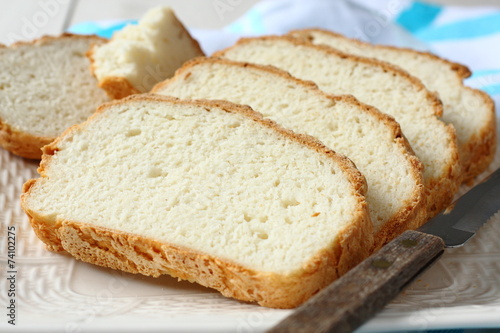 Fresh from the oven sliced gluten free bread on plate