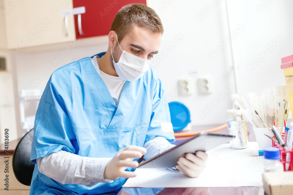 research scientist looking at the tablet, using technology research scientist looking at the tablet, using technology