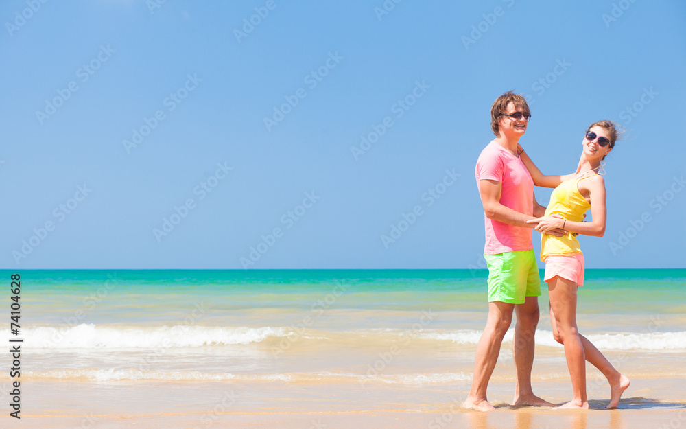 Couple hugging on a tropical beach at Maldives