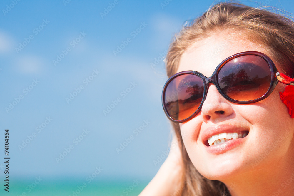 closeup long haired woman in bikini with flower in hair on closeup long haired woman in bikini with flower in hair on