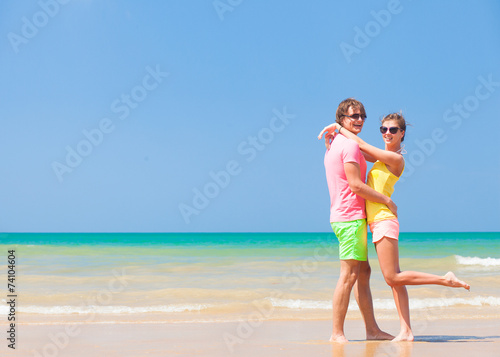 happy young couple at a tropical beach