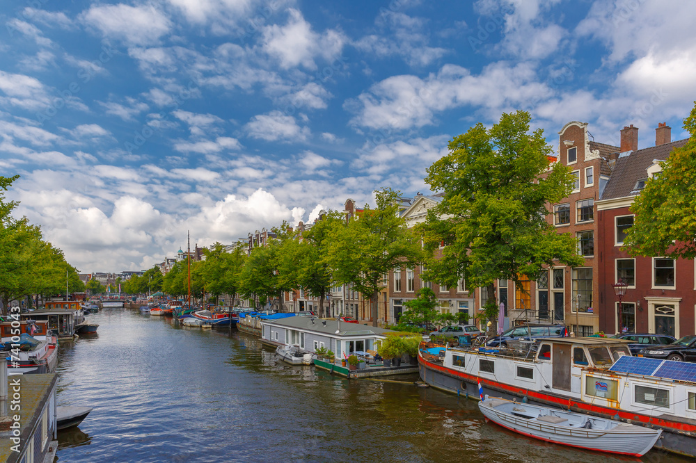 City view of Amsterdam canalsand typical houseboats, Holland, Ne