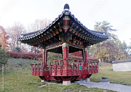 Ornate chinese pavilion in autumn park photo