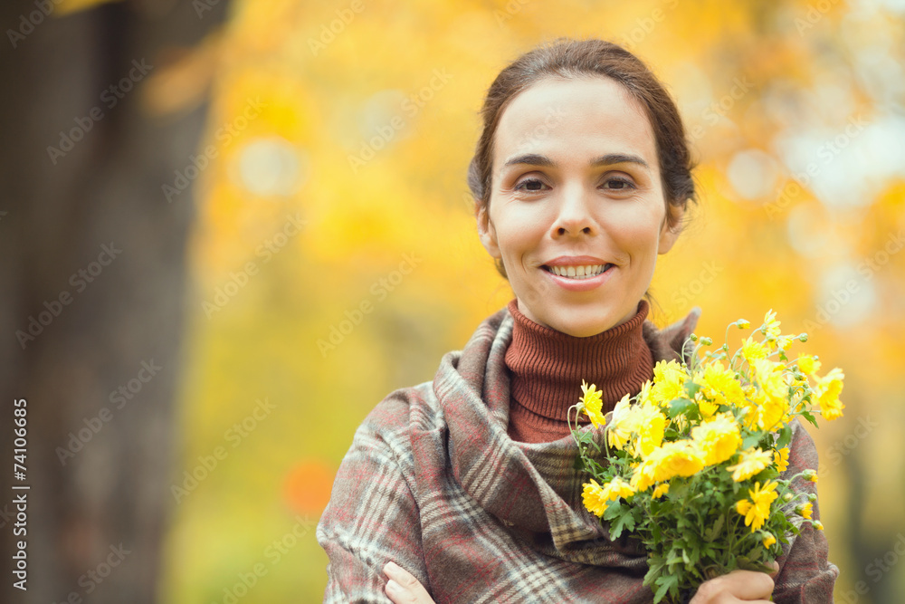 Portrait of a beautiful woman holding a bouquet Portrait of a beautiful woman holding a bouquet