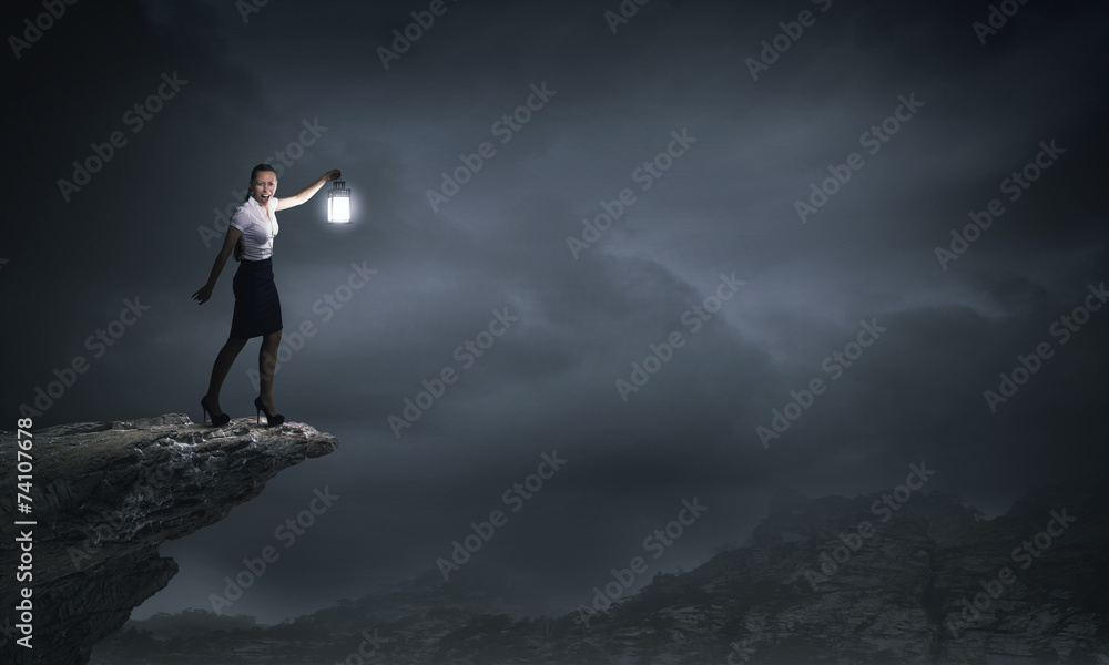 Businesswoman with lantern Businesswoman with lantern