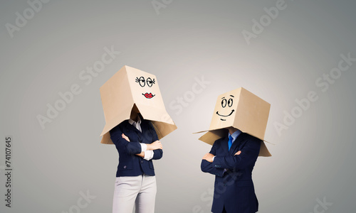 Business people wearing boxes