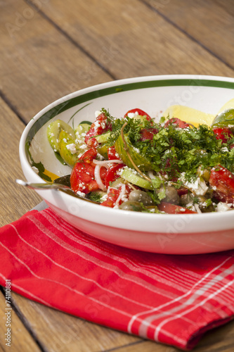 Bowl of Marinated Greek Salad with Red Napkin