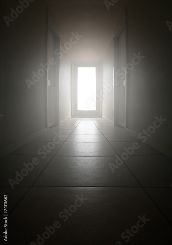 empty room with open door and white wall