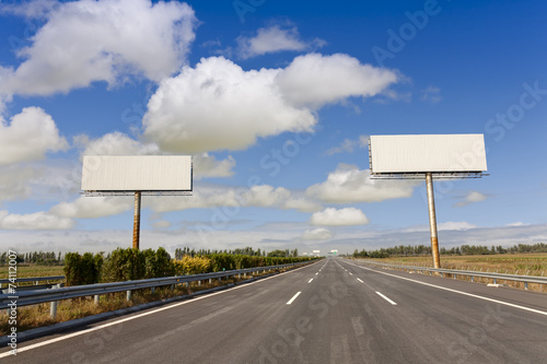 two blank billboards by the highway