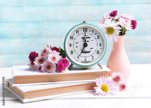 Fototapeta Naklejka Na Ścianę i Meble -  Beautiful flowers in vase on table on light blue background