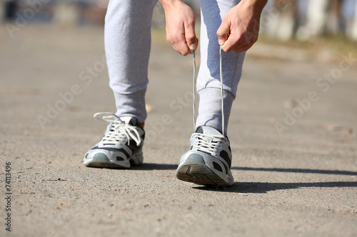 Runner tying shoelaces