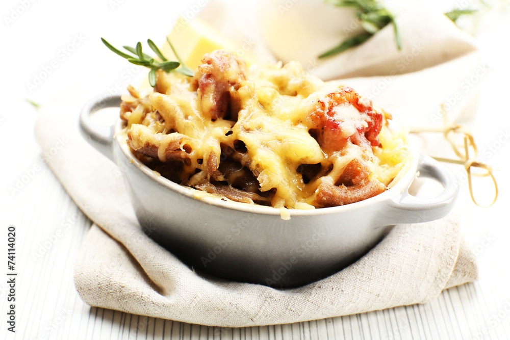 Pasta baked with vegetables and cheese in ceramic pot Pasta baked with vegetables and cheese in ceramic pot