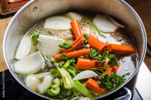 Stock pot with cut vegetables for soup photo