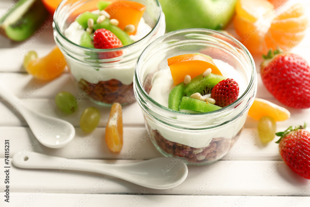 Healthy dessert with muesli and fruits on table Healthy dessert with muesli and fruits on table