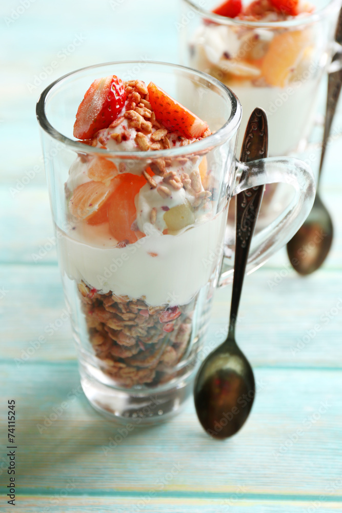 Healthy layered dessert with muesli and strawberries on table Healthy layered dessert with muesli and strawberries on table