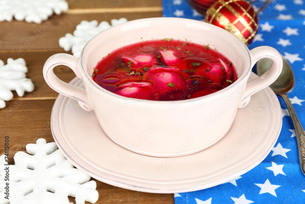 Traditional polish clear red borscht with dumplings and Traditional polish clear red borscht with dumplings and
