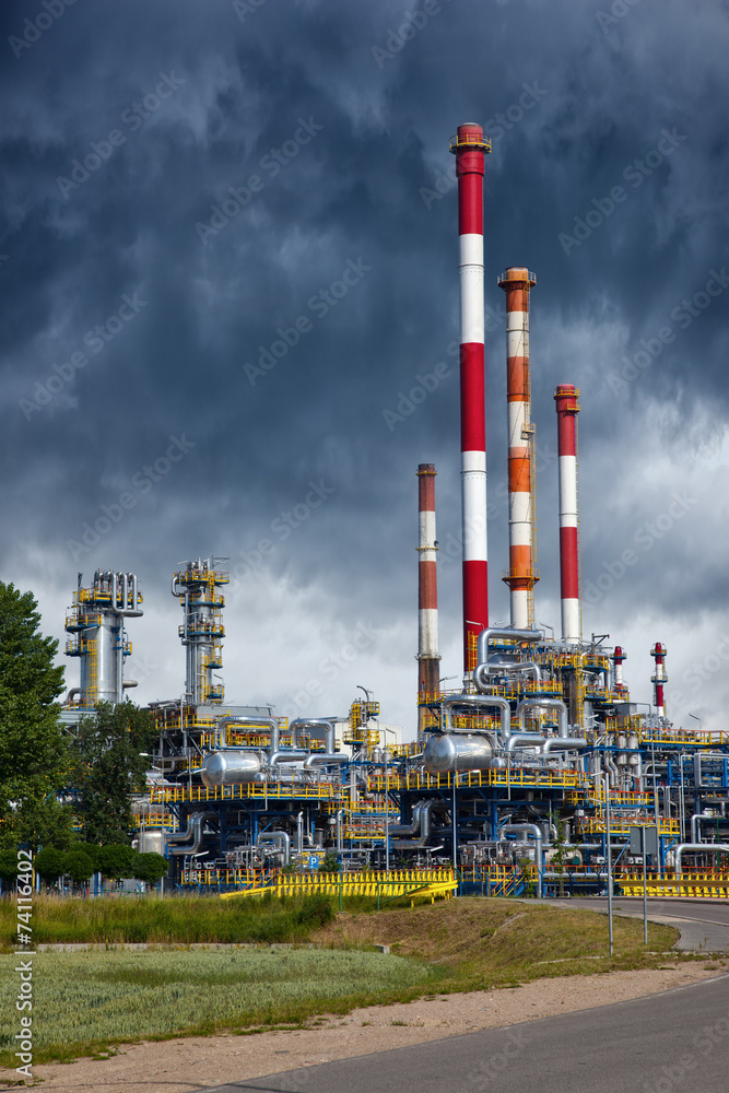 Oil industry refinery factory with dramatic sky.