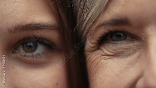 Close Up Of Mother And Daughter Faces Together photo