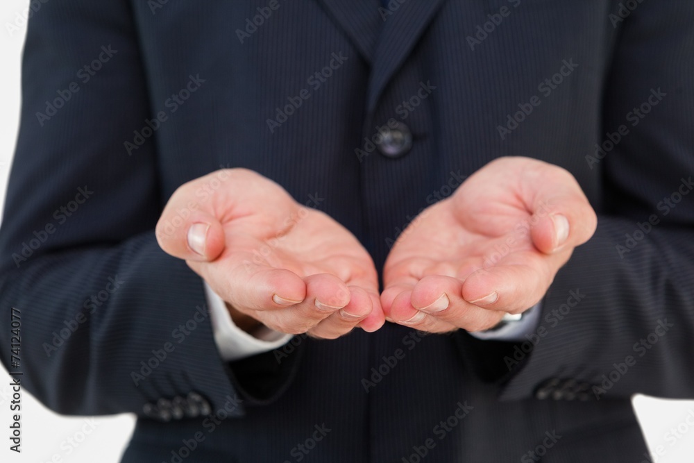 Mid section of a businessman with hands out