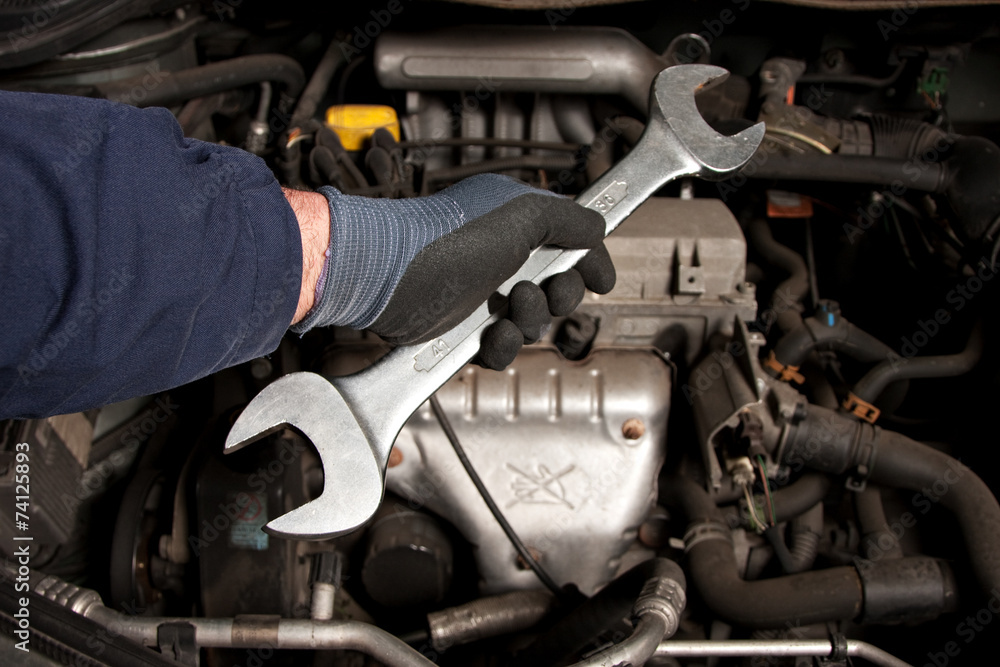 Mechanical repairs a car in the garage. Mechanical repairs a car in the garage.