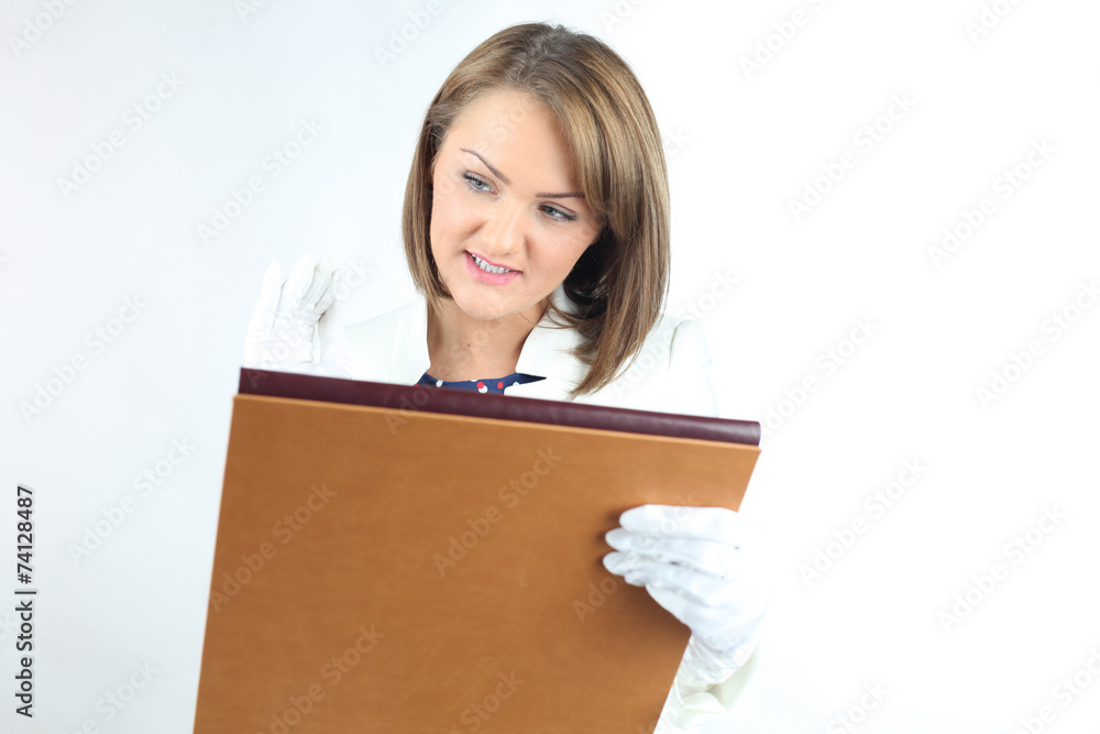 Business woman holding file in studio Business woman holding file in studio