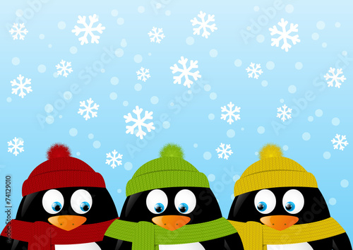 Cute cartoon penguins on winter background