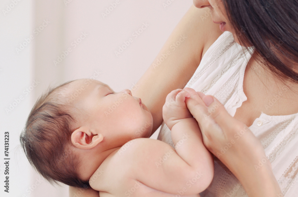 soft image of mother and her newborn baby soft image of mother and her newborn baby