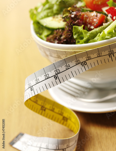 Salad in a Bowl with a Tape Measure