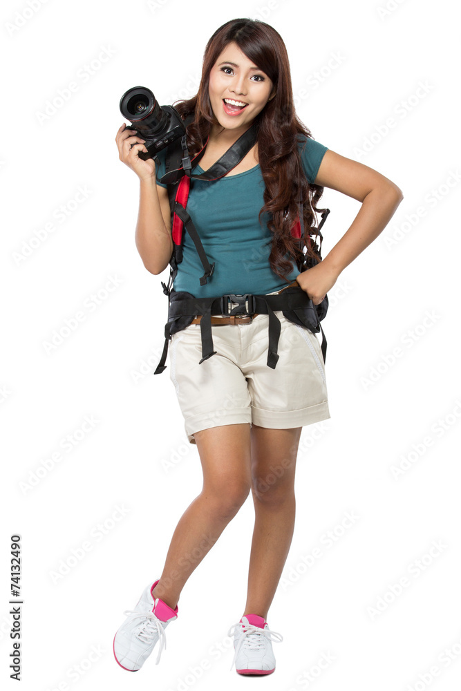 female backpacker going on vacation with backpack and camera female backpacker going on vacation with backpack and camera