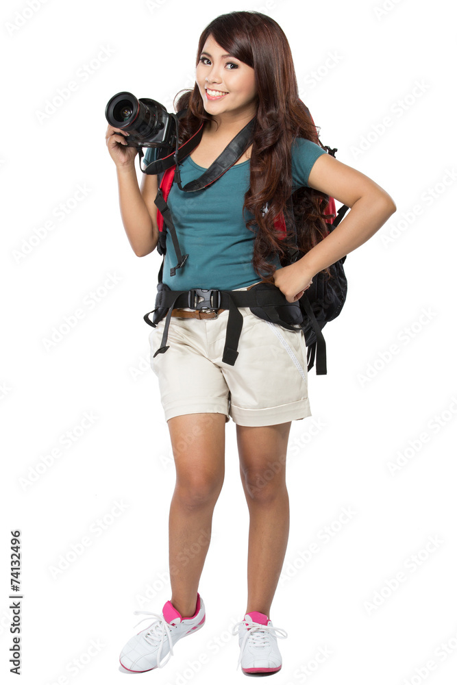female backpacker going on vacation with backpack and camera female backpacker going on vacation with backpack and camera