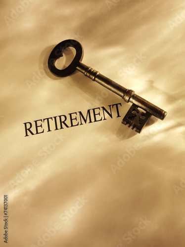 Old church key with the word retirement and gold lighting